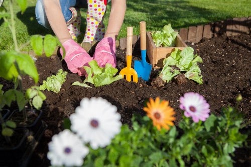 Local gardener working on seasonal planting in Dollis Hill